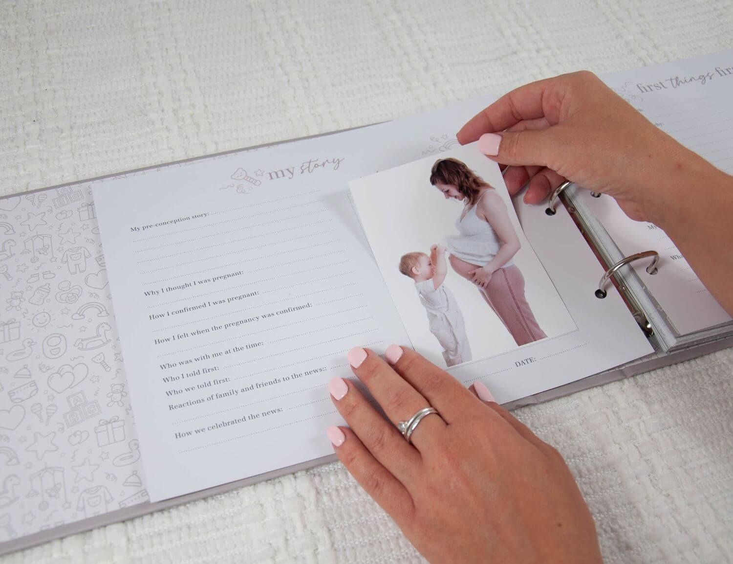 photo being placed in pregnancy journal