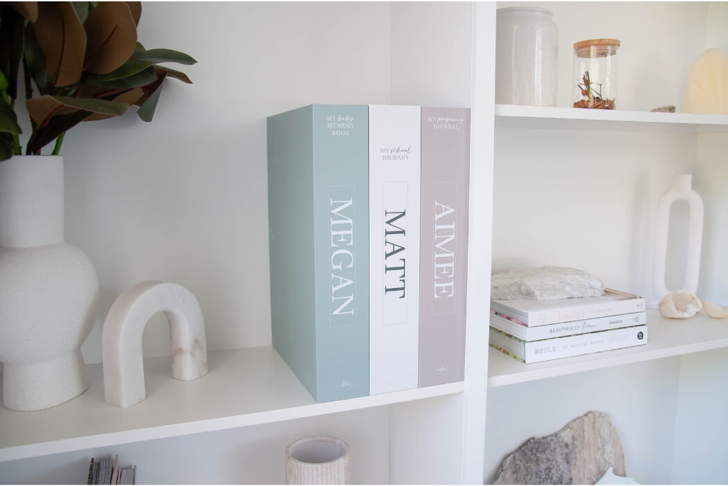 memory books displayed on a book shelf