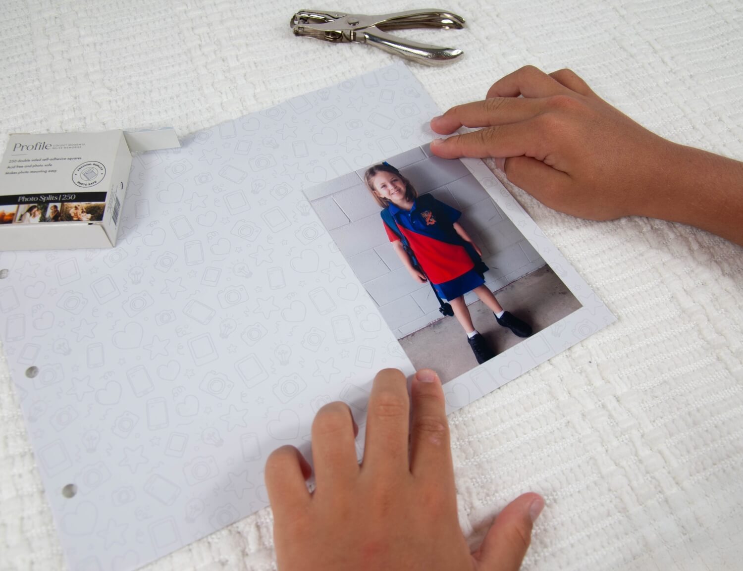 placing school photo in memory book