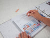 baby shower page in pregnancy journal being filled in